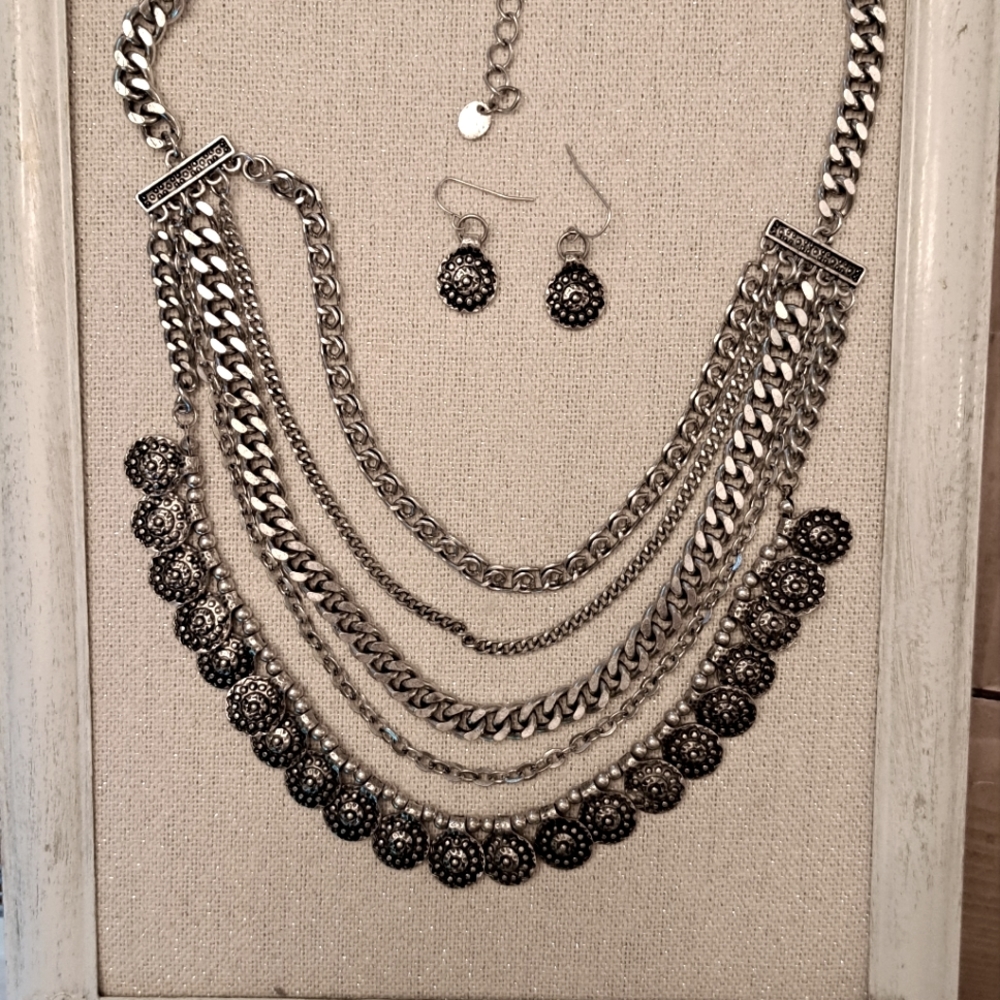 Lovely five strand, silver tone necklace with matching earrings
